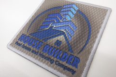 中央から波紋状に広がるグラデーションをベースに企業ロゴを加工したオリジナルプリントワッペンの作品。