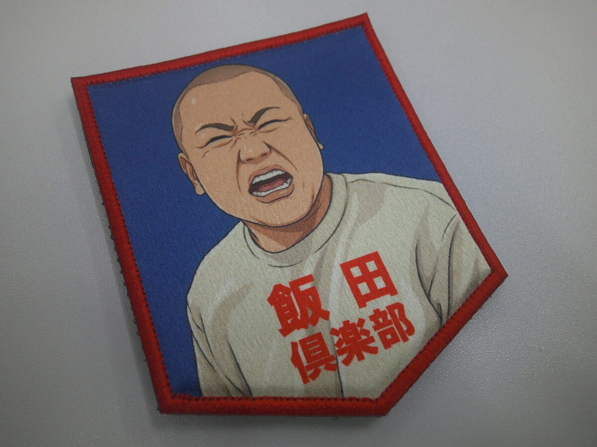 リアルなキャラクターデザインのプリントワッペン。細やかな表情さえも再現できることを示す制作実績。サブリックスサテンを使用。